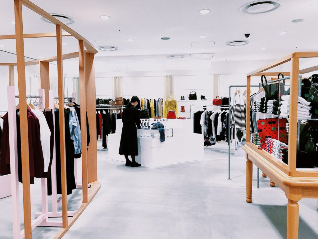 woman standing inside clothing area