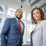 Man and Woman Smiling Inside Building