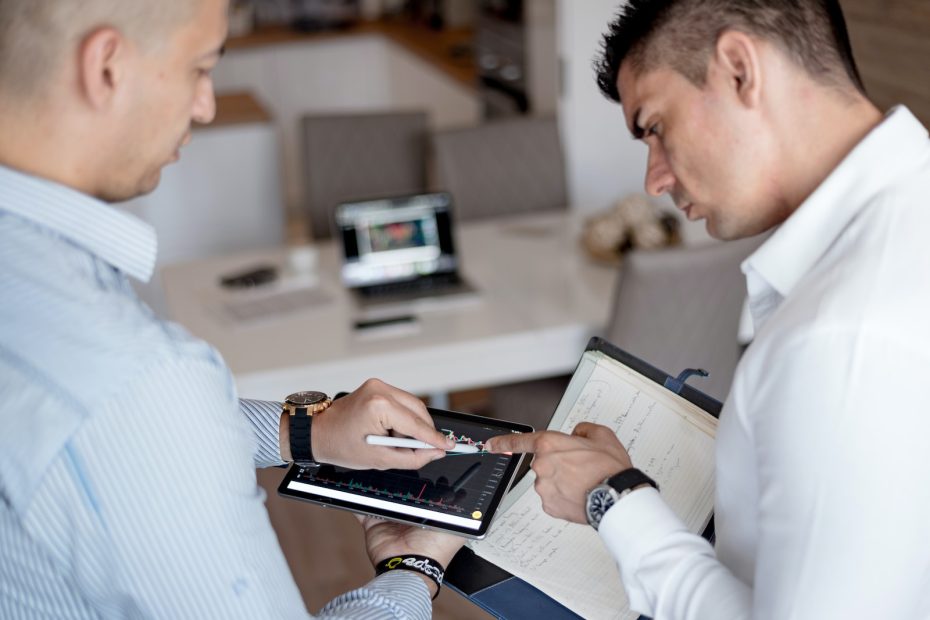 Man in White Dress Shirt Holding Black Tablet Computer