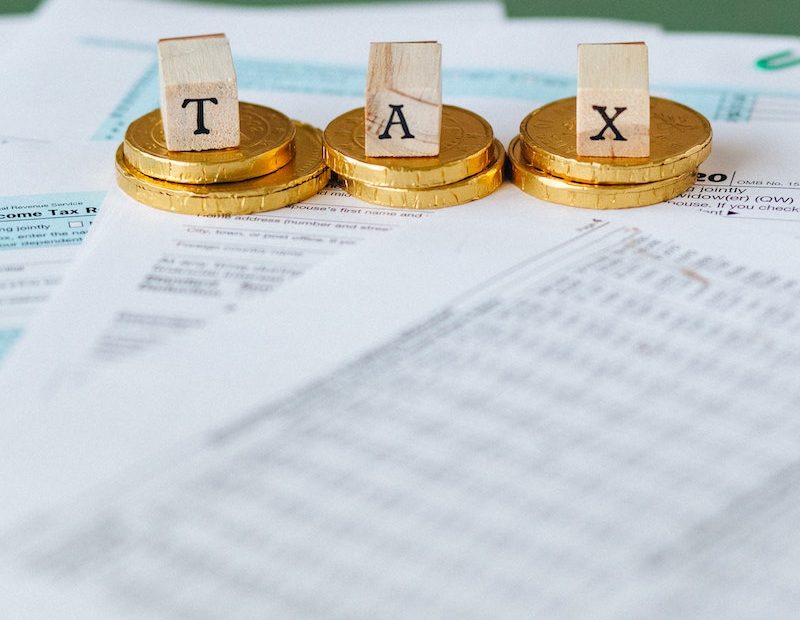 Gold Coins on Top of Documents