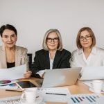 2 Women Sitting at the Table