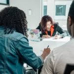 People Writing on Documents