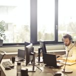 Washington Registered Agent Service: How To Pick The Best One Man With Headphones Facing Computer Monitor